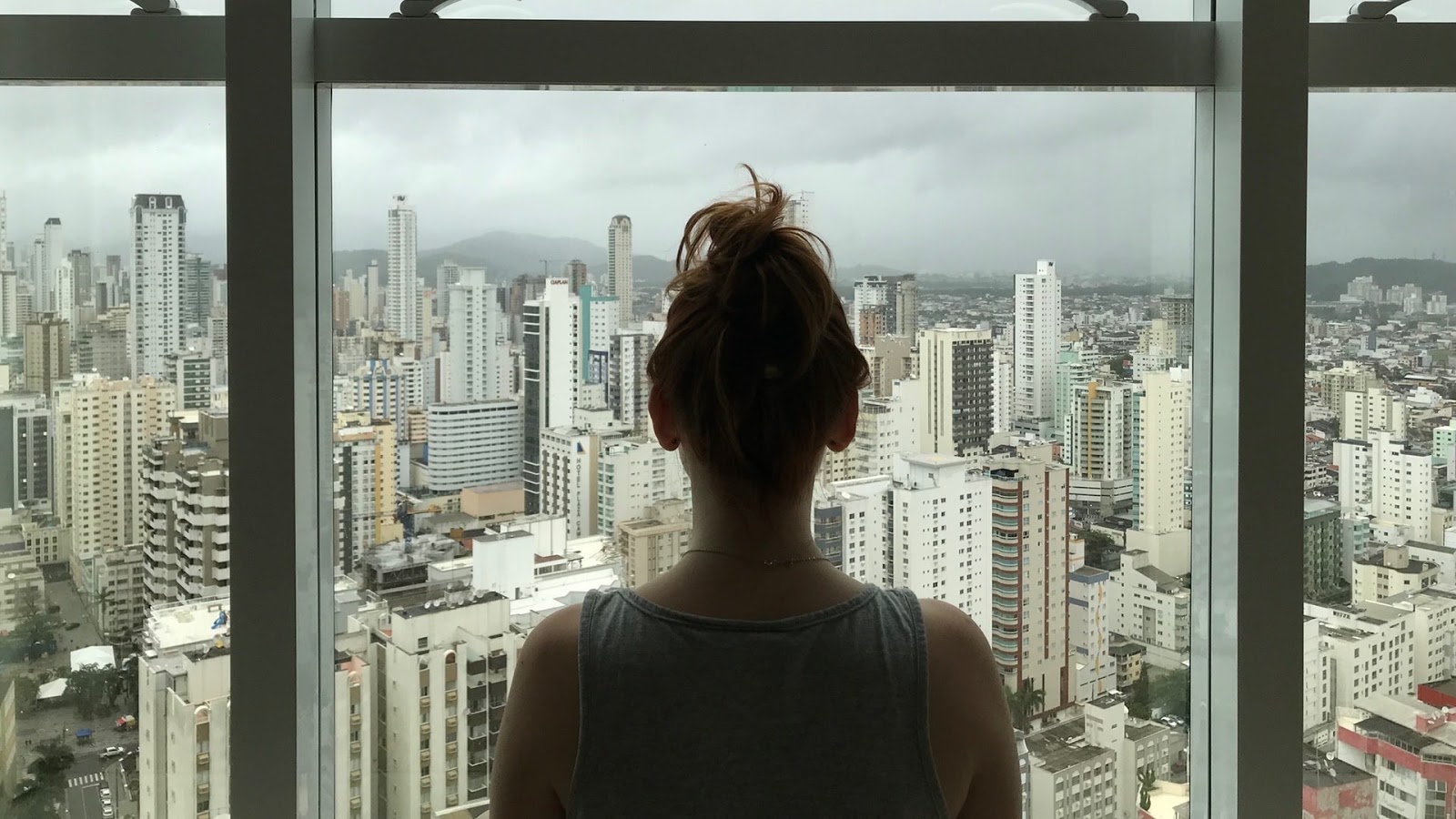 woman looking out a window